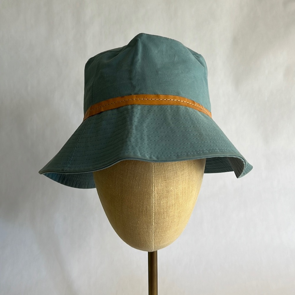 Coach light blue bucket hat with leather trim No rips?like new.